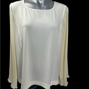 Vintage long sleeved blouse with permanently pleated sleeves.